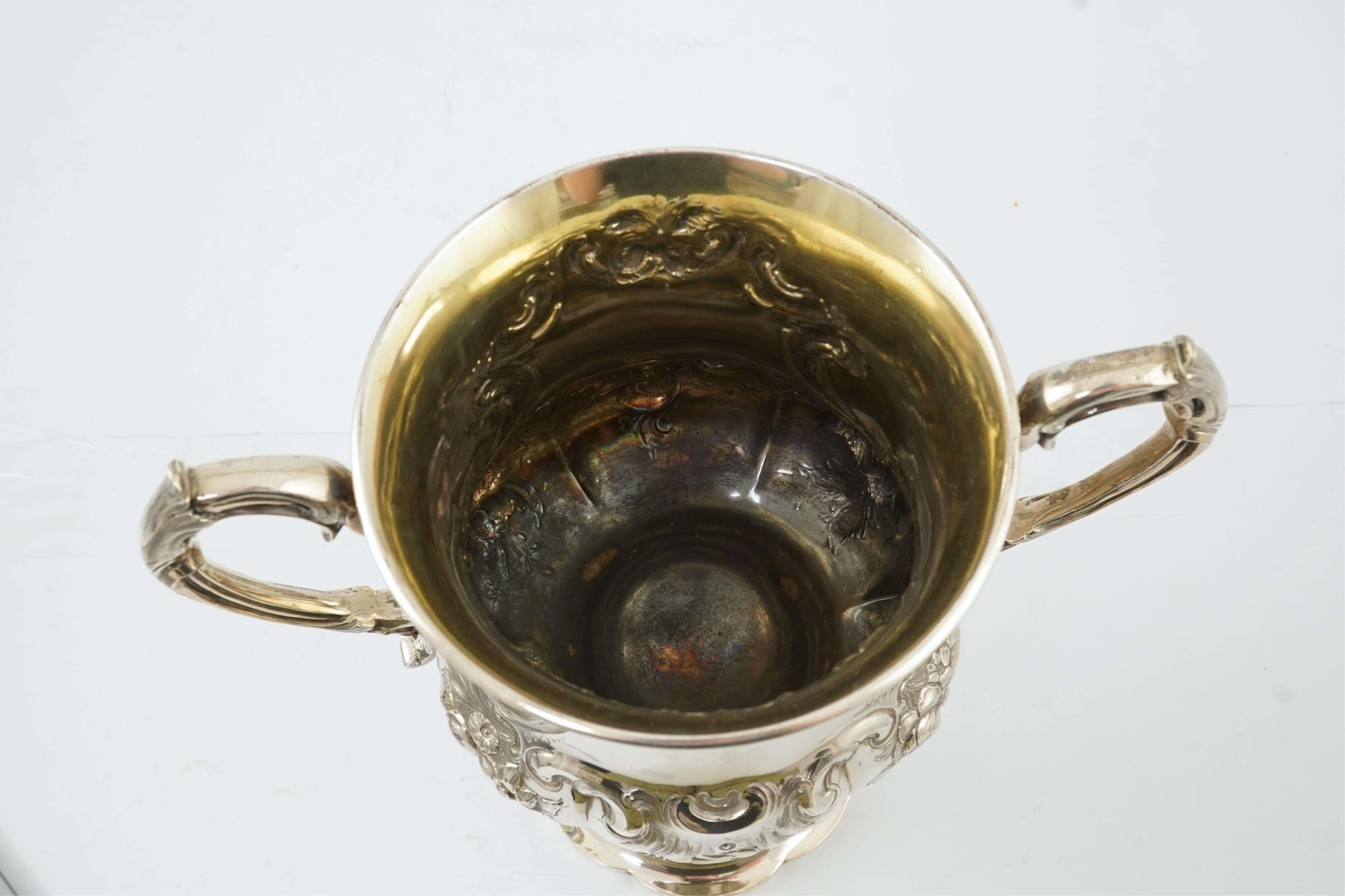 A Victorian embossed silver two handled presentation trophy cup by George John Richards & Edward Charles Brown